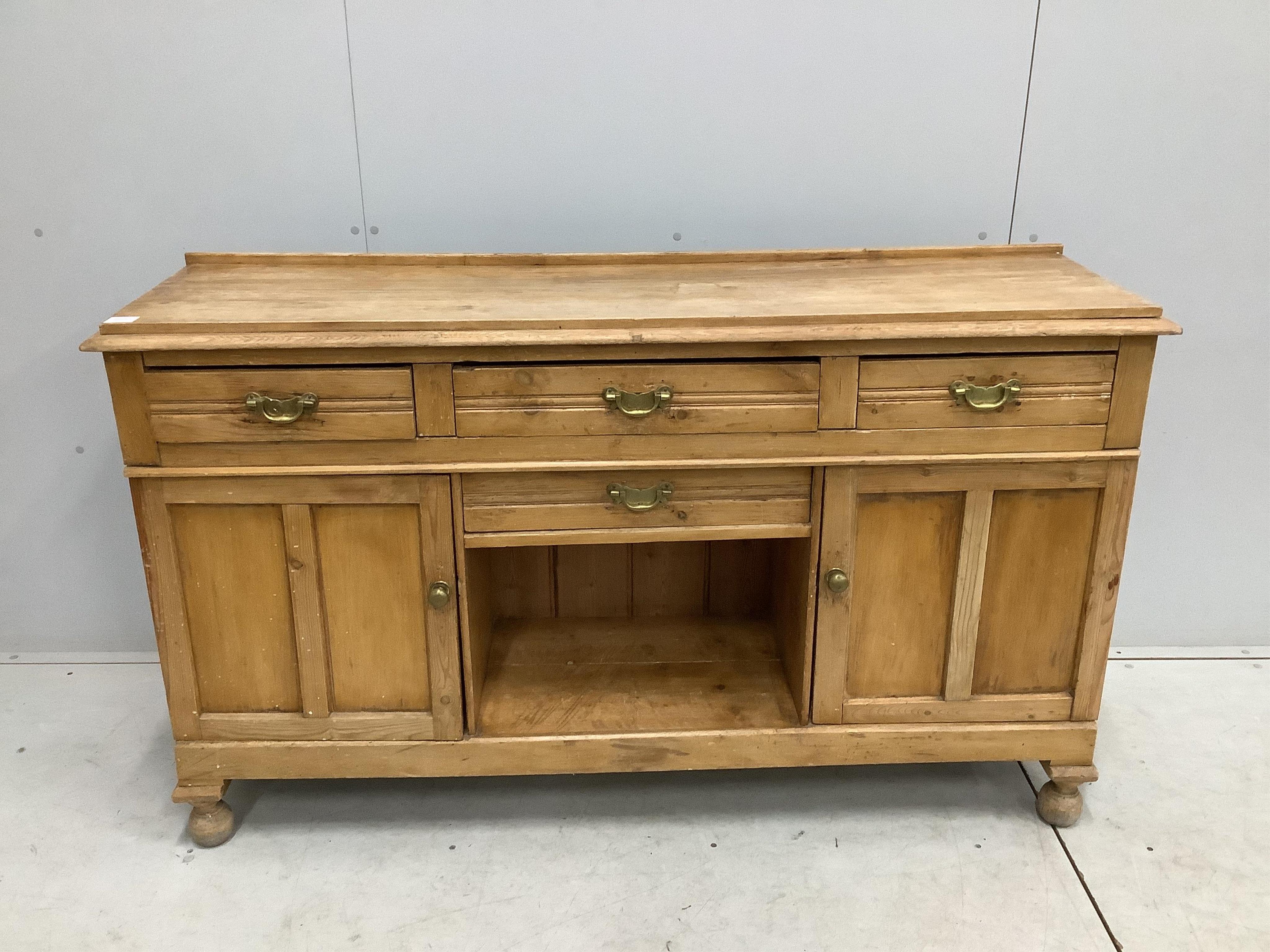 A late Victorian pine low dresser, width 154cm, depth 42cm, height 90cm. Condition - fair